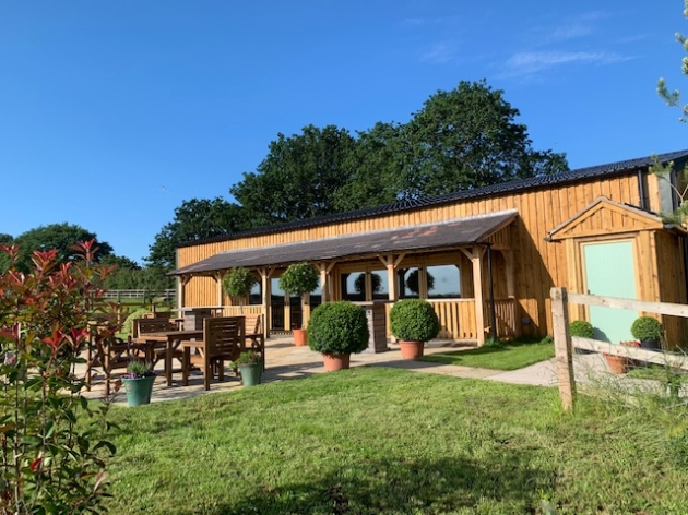 Coton House Farm Wedding Venue, image of the barn from the front of the gardens