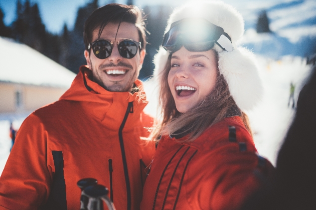 Couple posing together in the snow