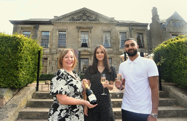 Laetitia Rattu and Balram Kandola posing outside Coombe Abbey Hotel