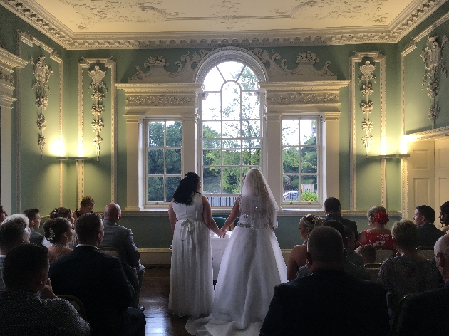 Two brides at the alter