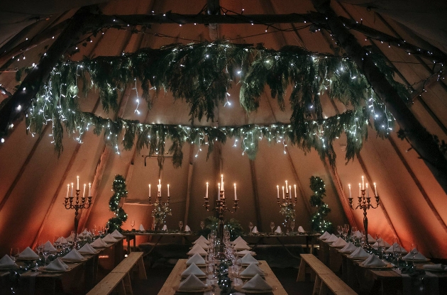 Inside a tipi decorated with fairylights