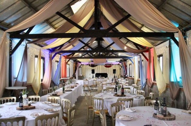 Wedding breakfast set up inside a barn