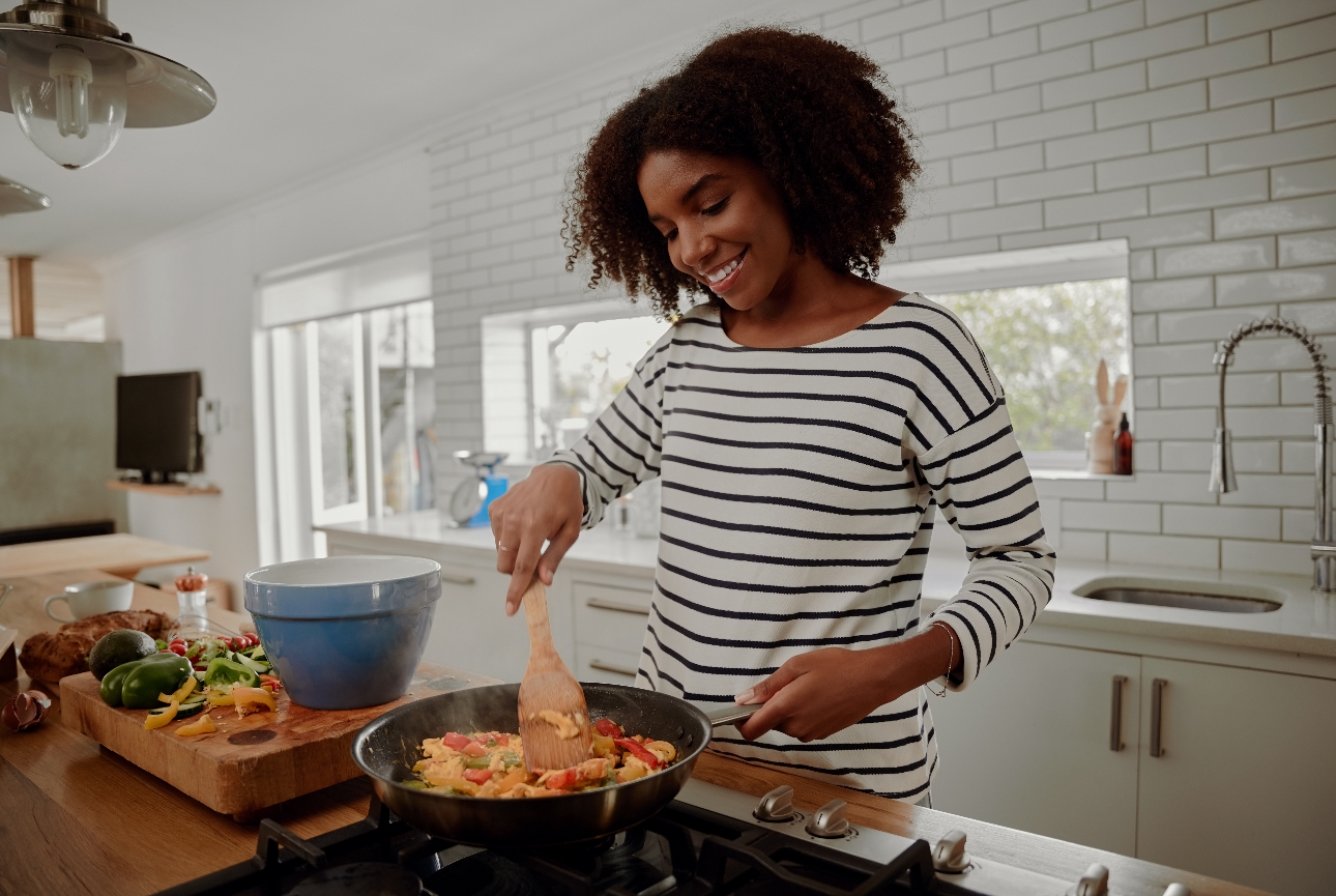 woman cooking at home in her kitchen