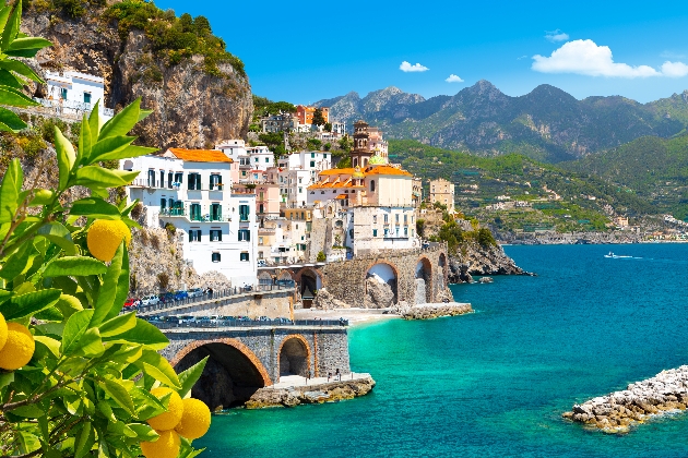 Beautiful view of Amalfi on the Mediterranean coast with lemons in the foreground, Italy