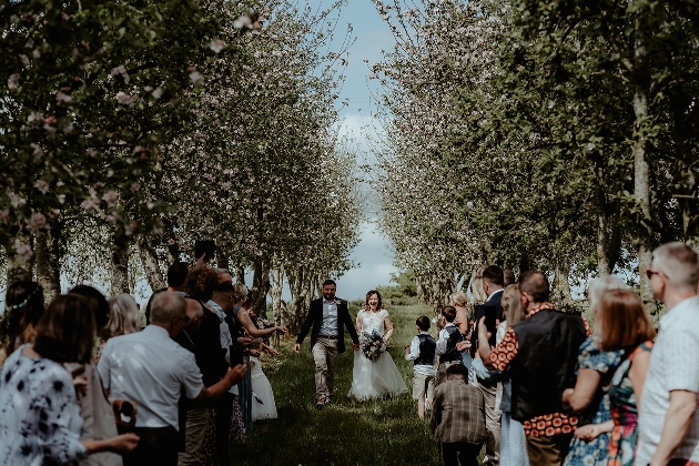 Bride and groom walking down the aisle