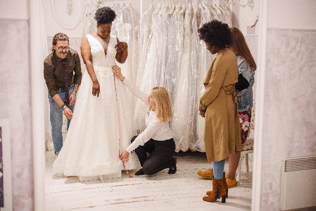 A women trying on a wedding dress