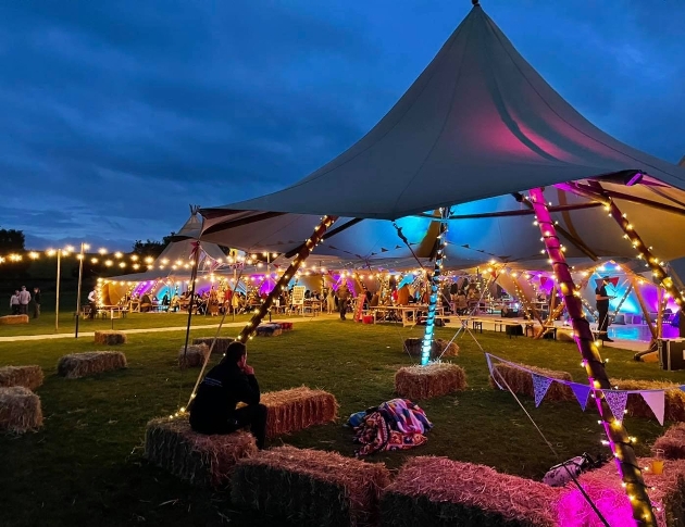 A tipi decorated in fairylights