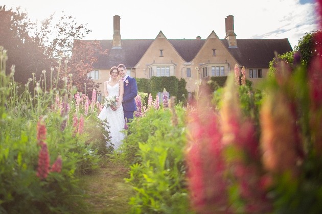 Bride and groom in the grounds of Mallory Court Hotel and Spa