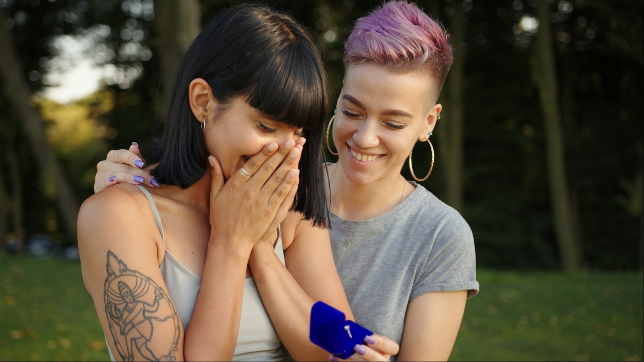 two women one with ring in box