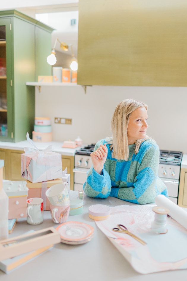  Yvonne Ellen in kitchen with lots of gifts on table 