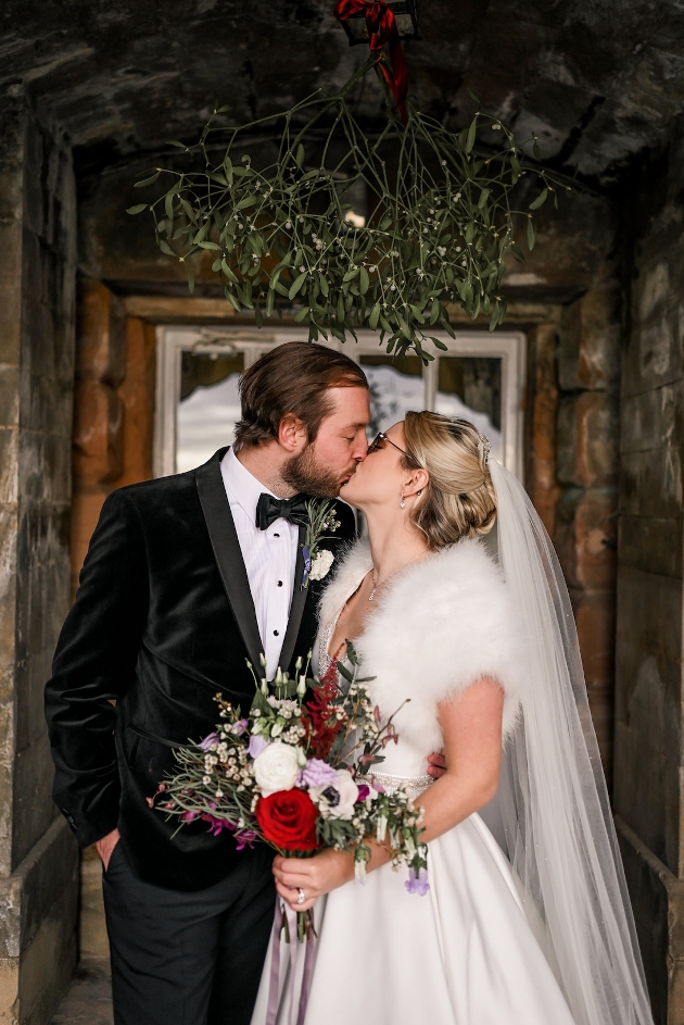 A bride and groom kissing