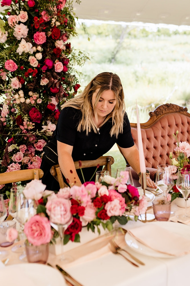 georgie laying out a table at reception