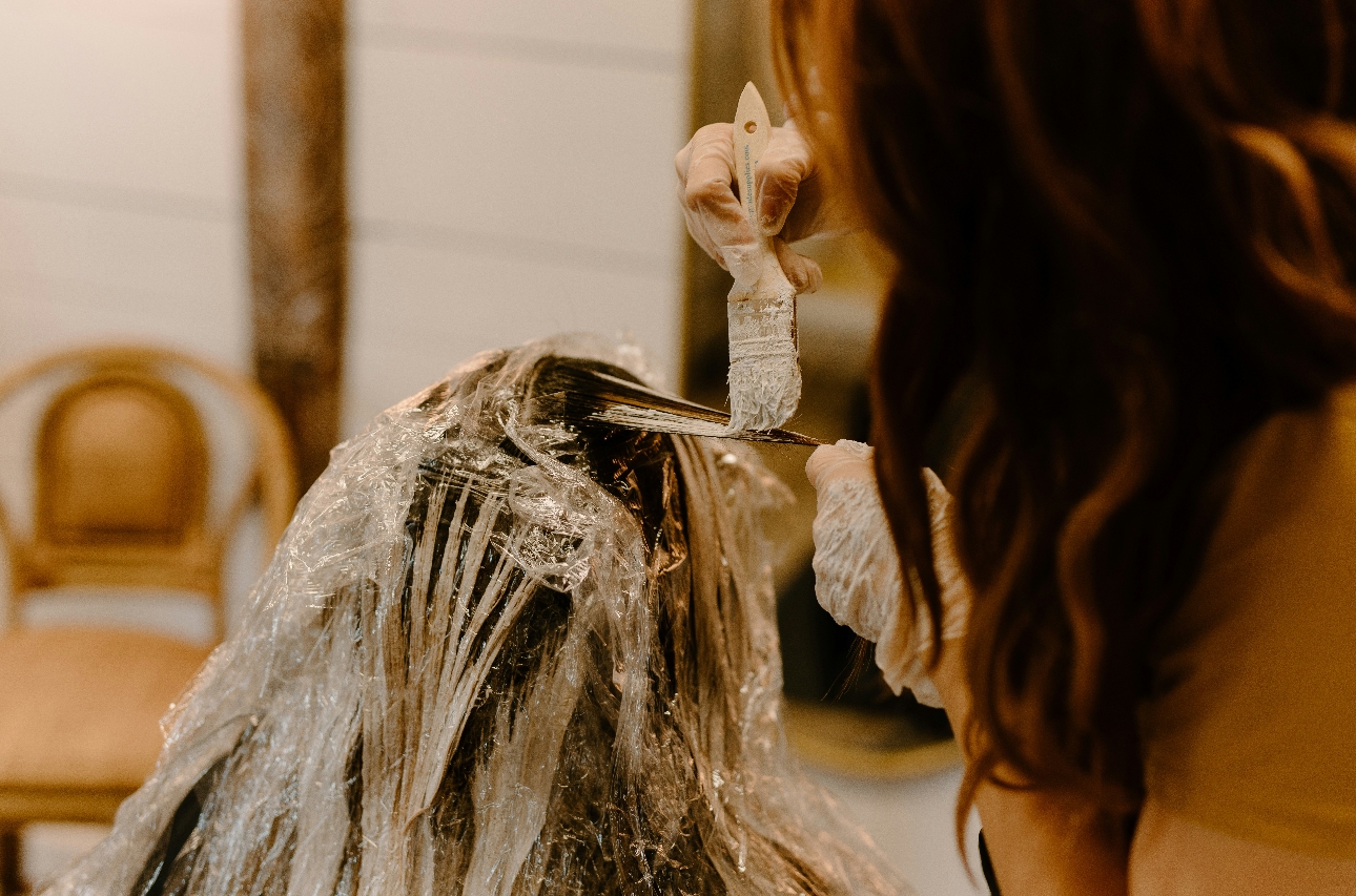 woman getting hair bleached