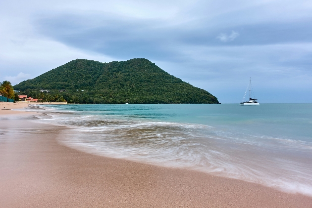 A beach with a mountain in the background